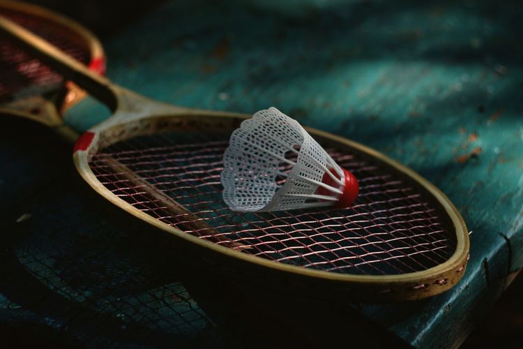 High angle view of shuttle cock on racket