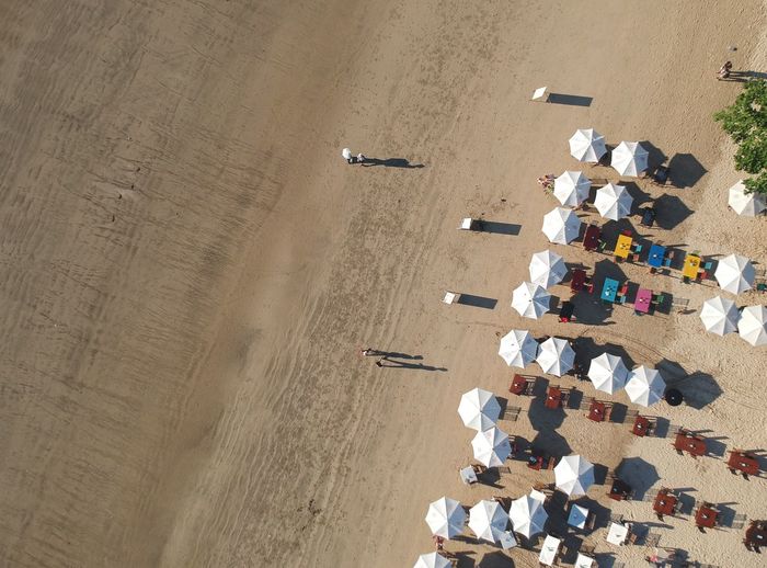 High angle view of deck chairs on beach