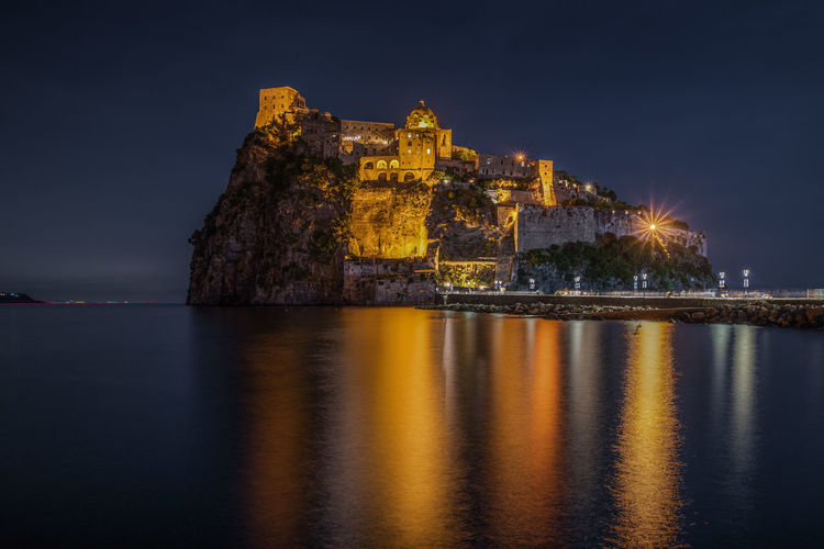 Night view of aragonese castle, the most famous landmark of ischia, campania region, italy