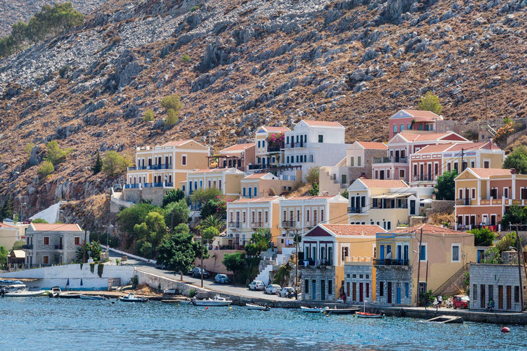 The traditional colorful houses and the port in symi island dodecanese, greece.