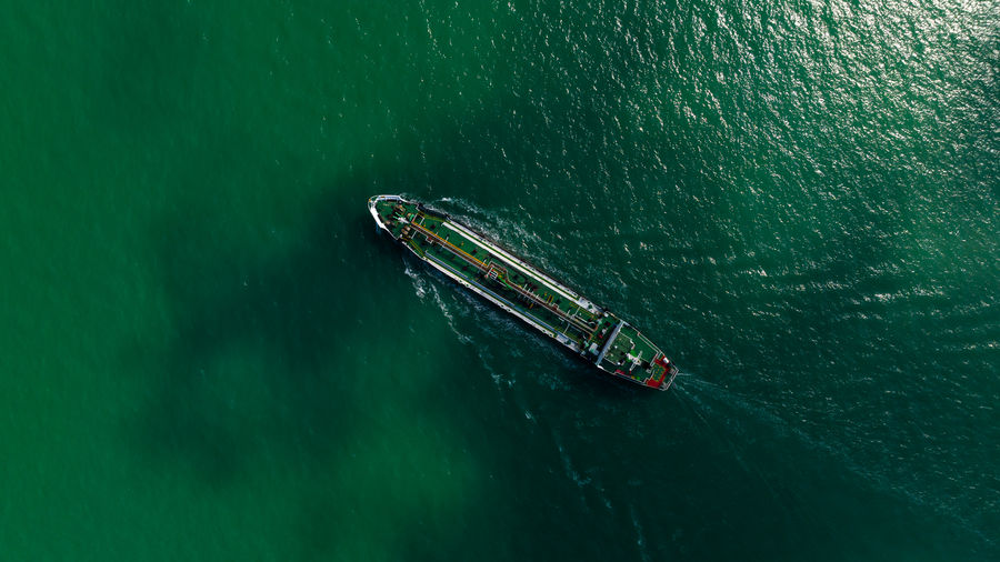 Oil ship tanker or liquid fied petroleum gas lpg sailing in green sea 
