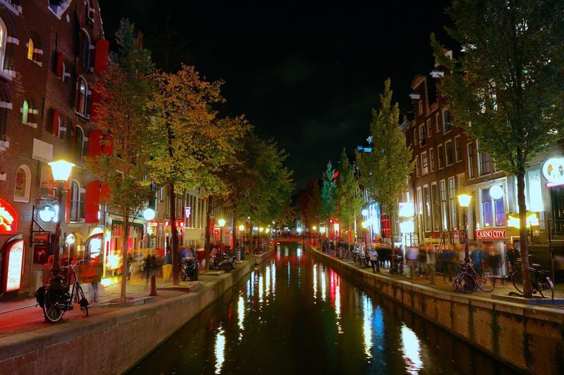 Reflection of illuminated buildings in canal