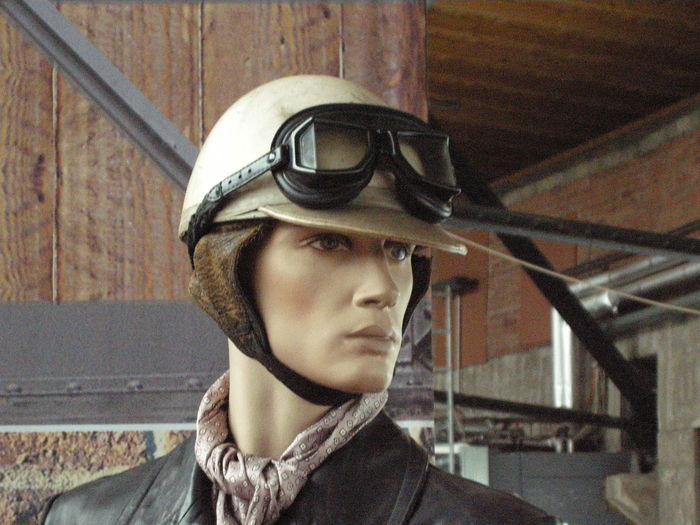 Close-up of mannequin with helmet and eyeglass in warehouse