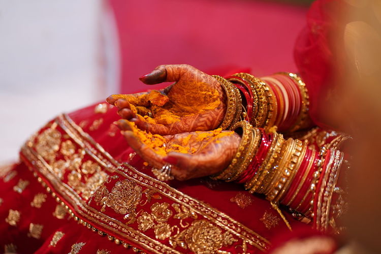 Midsection of bride during wedding ceremony