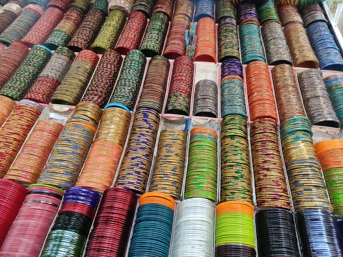 Full frame shot of multi colored bangles for sale in market