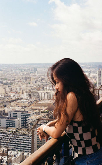 Model overlooking city of paris
