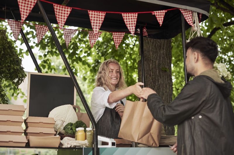 Clients buying food at food stall