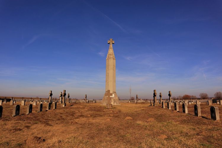 View of cemetery against blue sky