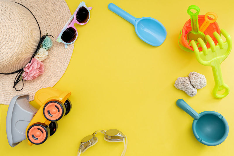 High angle view of various objects on yellow background