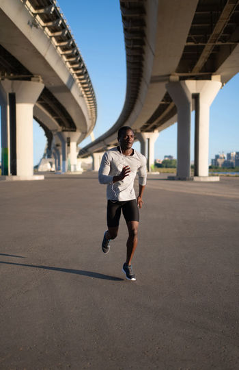 Athletic male running on track