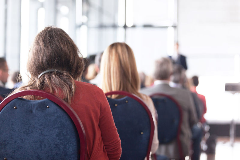 Rear view of people in seminar