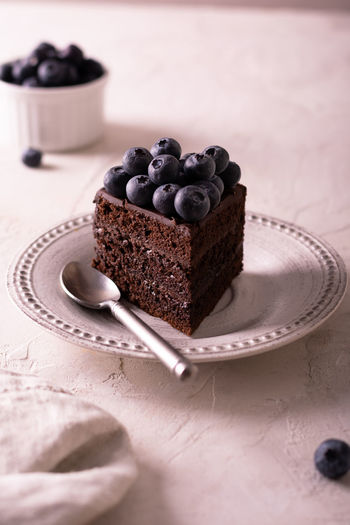 Close-up of chocolate cake with berries on table