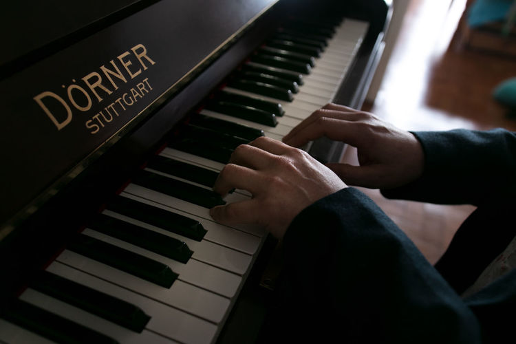 High angle view of man playing piano