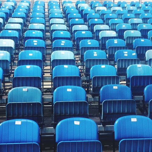 Full frame shot of blue bleachers at stadium