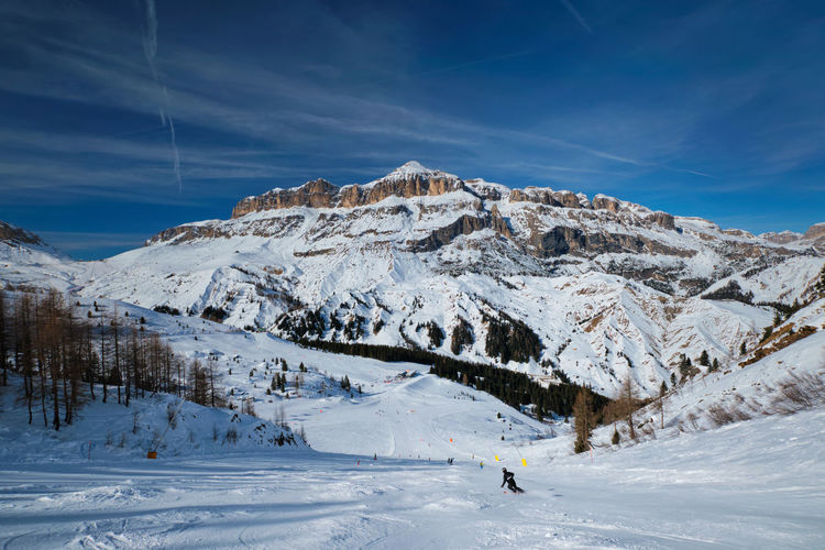 Ski resort piste slope in dolomites, italy