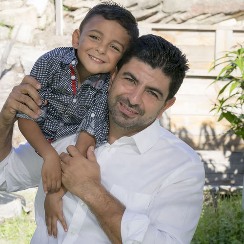 Portrait of smiling father with boy