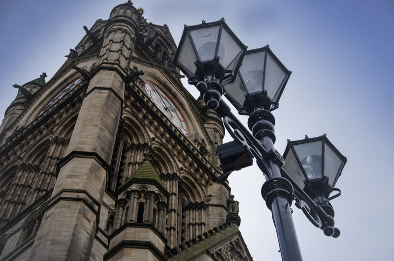 Low angle view of built structure against blue sky