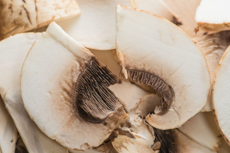 Close-up of sliced mushrooms, ingredients for pizza and roast.