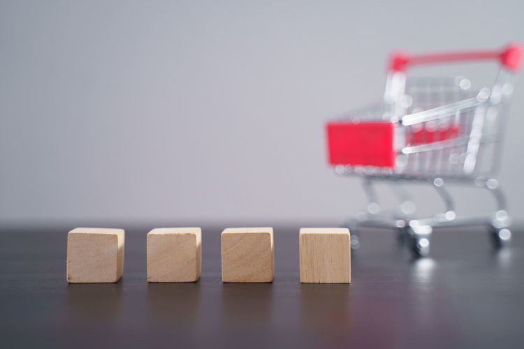 Close-up of toys on table against white background