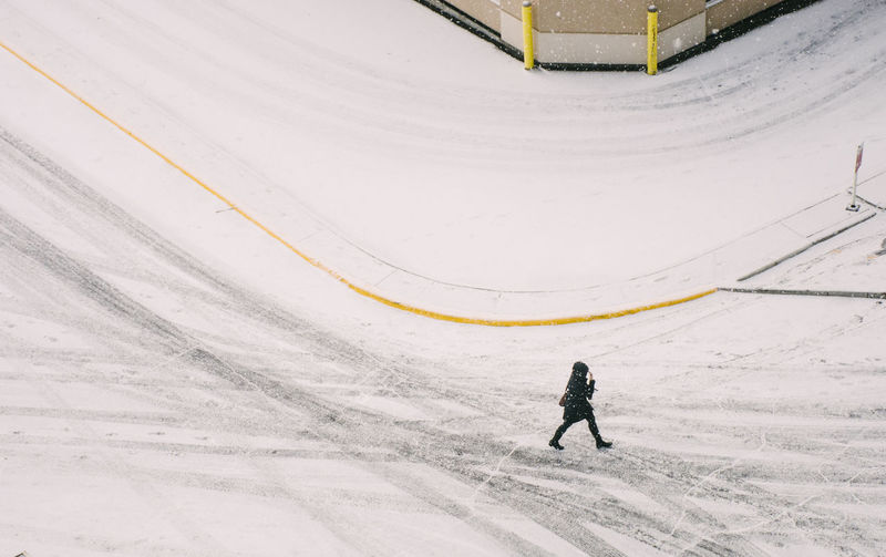 Woman on snow covered street