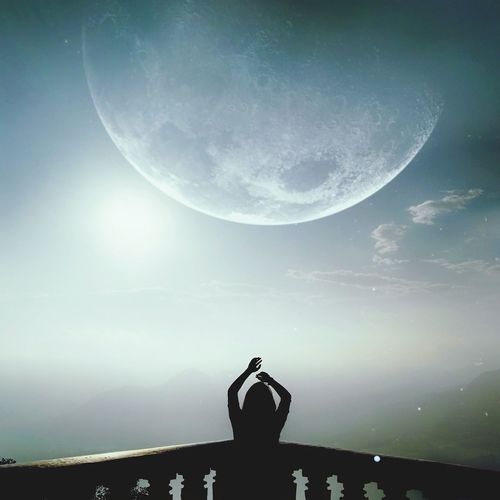 Man against moon at night
