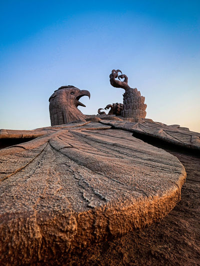 Low angle view of rock statue of bird jatayu, a hindu mythic creature from ramayana 