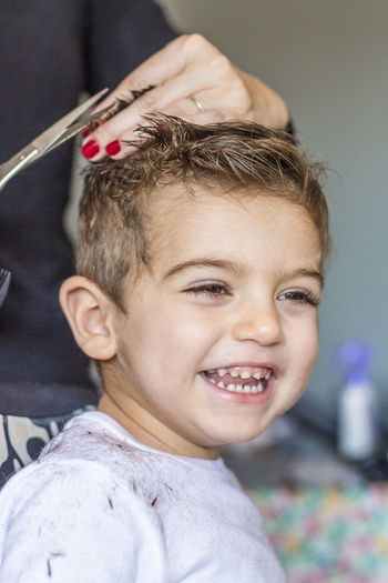 Portrait of boy having haircut