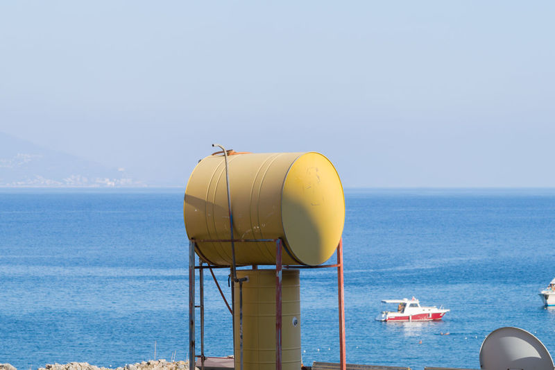Yellow thermosiphon against sea