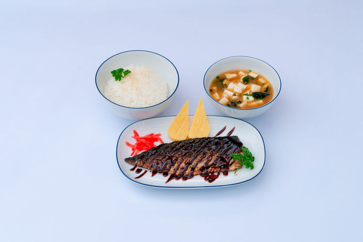 High angle view of food in plate on white background