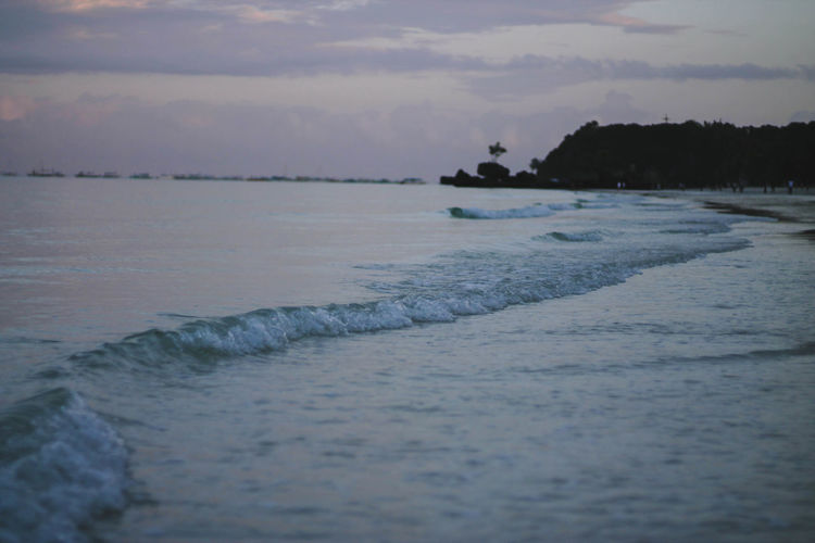 Scenic view of sea against sky at sunset