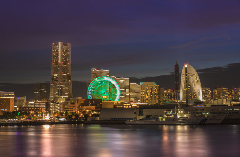 Night panorama from osanbashi pier port of the landmark tower and the cosmo clock 21 big wheel.