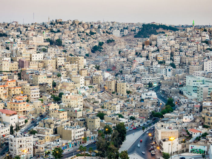 High angle view of buildings in city against sky