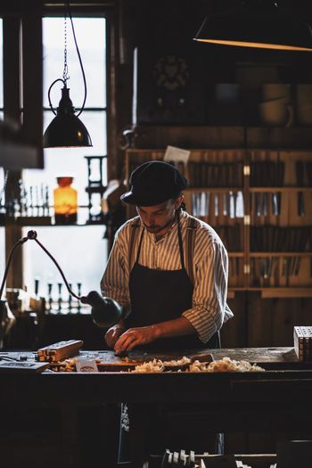 https://www.instagram.com/david_sarkisov_photography/ Camera : Nikon D610 / Lens 85.00 mm f/1.4 Business Cap Food Food And Drink Front View Holding Indoors Men Mid Adult Occupation One Person Preparation Preparing Food Real People Small Business Standing Table Three Quarter Length Waist Up Workbench Working Summer In The City A New Beginning 50 Ways Of Seeing: Gratitude The Modern Professional Human Connection Streetwise Photography
