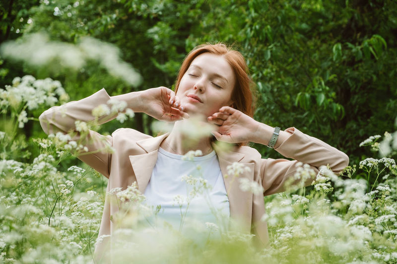 Beautiful young woman lying on land