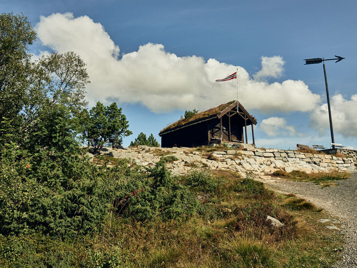 House on field against sky