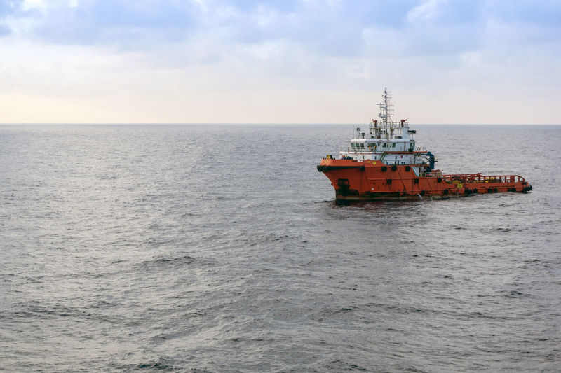 Ship in sea against sky