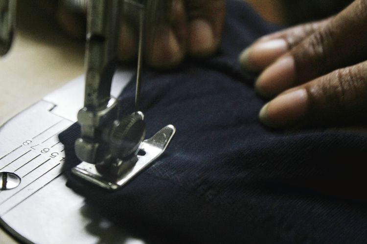 Cropped image of tailor working on cloth